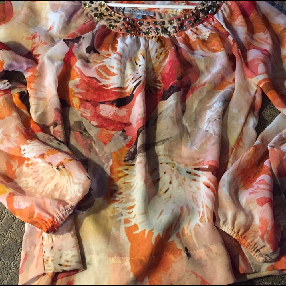 Orange and coral sheer Jennifer Lopez blouse.